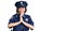 Young beautiful girl wearing police uniform praying with hands together asking for forgiveness smiling confident