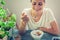 Young beautiful girl woman eating yogurt with flakes and berries