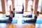 Young beautiful group of sportswomen practicing yoga