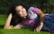 Young beautiful and happy Asian Chinese 20s woman lying relaxed