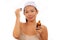 Young beautiful and happy Asian Korean woman applying skincare wrinkle prevention serum treatment or aging beauty product on her