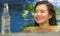 Young beautiful and happy Asian Korean woman in bikini enjoying vacation at swimming pool relaxed and cheerful bathing at villa or