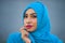 Young beautiful and happy Asian woman in hijab muslim head scarf posing to the camera playful having fun and looking seductive and