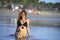 Young beautiful and happy Asian woman smiling relaxed having fun on tropical beach in Bali Asia