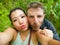 Young beautiful and happy mixed ethnicity couple beautiful Asian Chinese woman and white man in love taking selfie picture