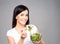 Young, beautiful and healthy teenage girl with a bowl of salad