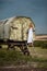 Young and beautiful hippie girl near trailer