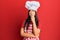 Young beautiful hispanic girl wearing baker uniform and cook hat serious face thinking about question with hand on chin,