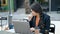 Young beautiful hispanic woman business worker being sick working at coffee shop terrace