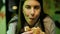 Young beautiful hispanic woman eating delicious hamburger with dirty mouth at the restaurant