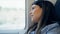 Young beautiful hispanic woman smiling happy looking through the window inside train wagon