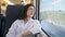 Young beautiful hispanic woman smiling happy looking through the window at train station