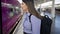 Young beautiful hispanic woman walking inside the train at train station