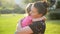 Young beautiful mother hugging and comforting her baby daughter, mom hugs baby, woman soothes girl