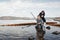 Young, beautiful mother and son have fun fishing on the lake