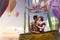 Young beautiful multiethnic couple kissing in the hot air balloon.