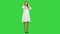 Young beautiful nurse posing with stethoscope on a Green Screen, Chroma Key