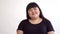 Young beautiful overweight Asian girl on white background smiling. Happy Authentic woman