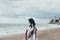 Young beautiful pragnant woman posing near sea at the beach