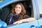 Young beautiful pretty girl sitting inside credit car. businesswoman driver. automobile trade