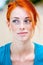 Young beautiful redhead freckled woman thinking