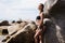 young beautiful russian girl in little black bikini. Slim body woman on tropical beach in Thailand. Model vacation