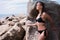 young beautiful russian girl in little black bikini. Slim body woman on tropical beach in Thailand. Model vacation