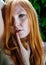 Young beautiful sexy redhead Woman with finger sexy lips oral sensuality