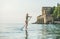 Young beautiful slavian woman tourist practicing paddle boarding, Alanya