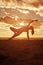 Young beautiful slim woman silhouette practices yoga on the beach at sunset. Yoga at sunrise