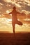 Young beautiful slim woman silhouette practices yoga on the beach at sunset. Yoga at sunrise