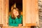 Young beautiful smiling happy woman resting window portrait.