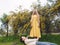 Young beautiful smiling women in spring Australian Golden wattle trees.