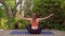 Young beautiful sportswoman yoga Health and wellness. Sports and recreation on wooden deck outdoor in nature.