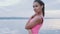 Young beautiful stylish girl posing at beach