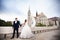 Young beautiful stylish pair of newlyweds walking by the Fisherman`s Bastion in Budapest, Hungary