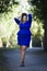 Young beautiful stylish plus size fashion model in blue dress outdoors, xxl woman on nature