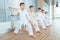 Young, beautiful, successful multi ethical kids in karate position