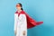 Young beautiful superhero doctor woman tired