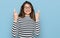 Young beautiful teen girl wearing casual clothes and glasses gesturing finger crossed smiling with hope and eyes closed