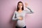 Young beautiful teenager girl pregnant expecting baby over isolated pink background Swearing with hand on chest and open palm,