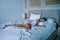 young beautiful and tired Asian woman 20s or 30s sleeping peacefully resting happy and relaxed dreaming on her bed at home apart