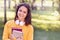 Young beautiful and trendy student girl holding books.