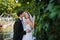 Young beautiful wedding couple at the wall