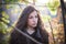 Young beautiful woman autumn portrait in forest natural light