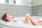 Young beautiful woman in a bath