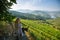 Young beautiful woman with blond dreadlocks meets sunset on the viewing point of Douro Valley, Portugal.