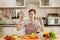 Young beautiful woman is cooking in the kitchen.