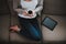 Young Beautiful Woman with Cup of Coffee on Sofa