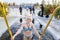 young beautiful woman dives into an ice hole on a winter day